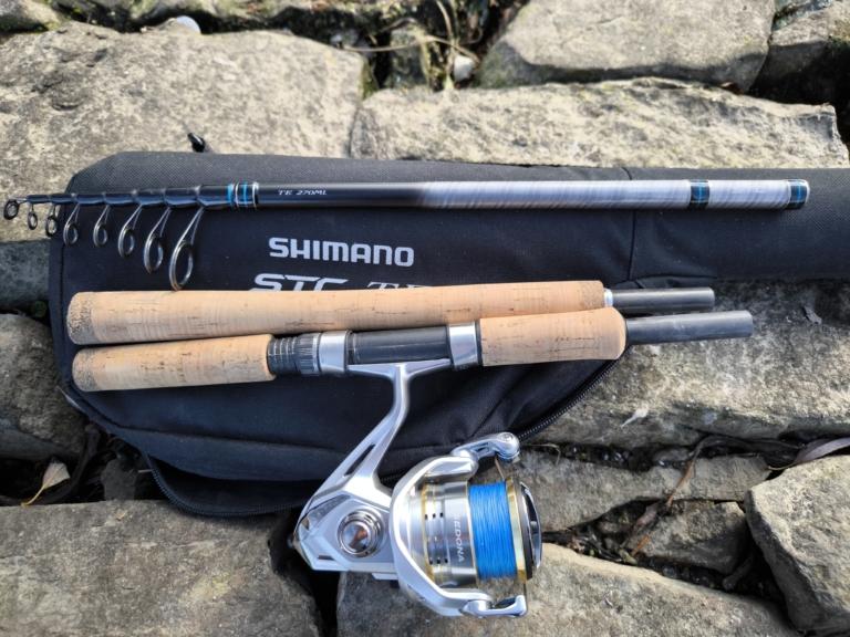 3 Teile der Shimano STC Mini Tele 270ML Reiserute liegen auf Rutentasche.